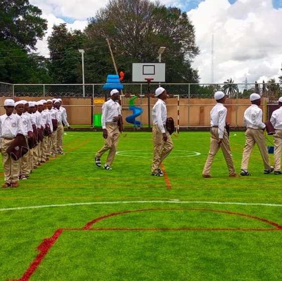 children lining up in the field